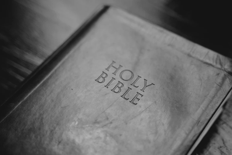 a bible sitting on top of a wooden table, shiny silver, detailed photo of an album cover, thumbnail, profile picture 1024px