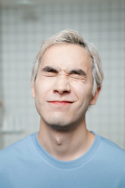 a close up of a person with a tooth brush, an album cover, by Karl Matzek, trending on reddit, photorealism, gray hair, sleepy expression, face muscles, xqc
