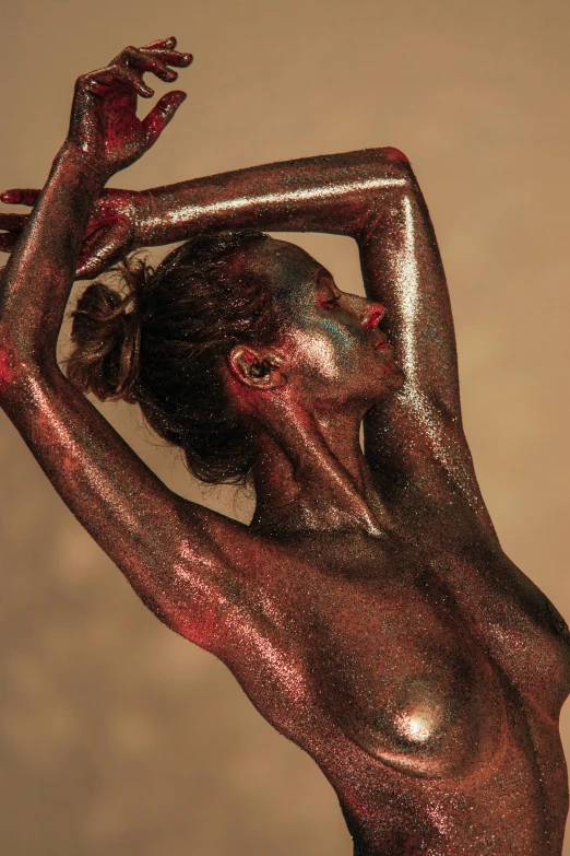 a naked woman with red paint on her body, an album cover, inspired by Hedi Xandt, pexels contest winner, metallic bronze skin, ( ( dark skin ) ), expressive pose, 5 0 0 px models