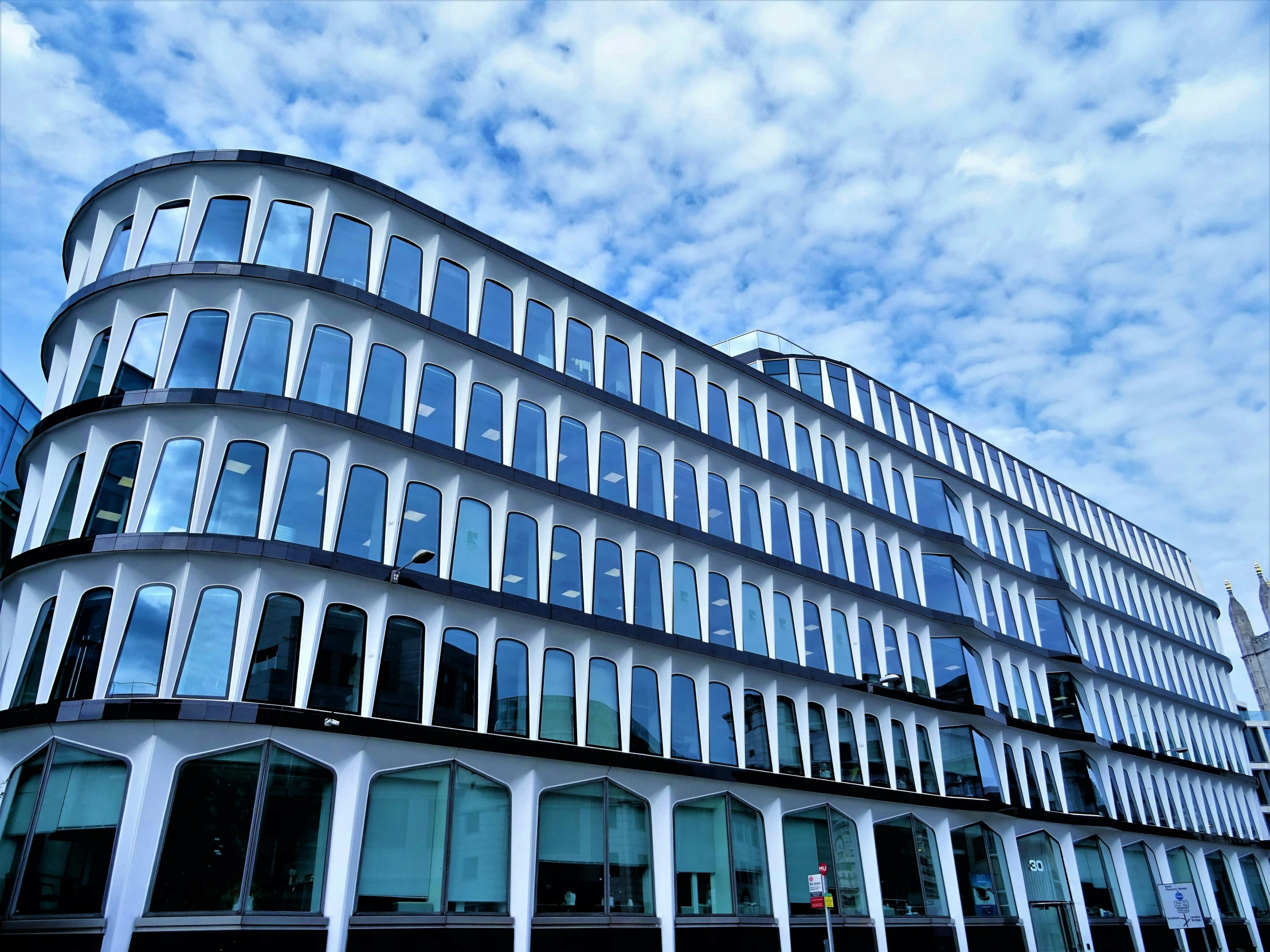 a very tall building with a lot of windows, unsplash, bauhaus, sky blue, square, ornate, ultrastation hq