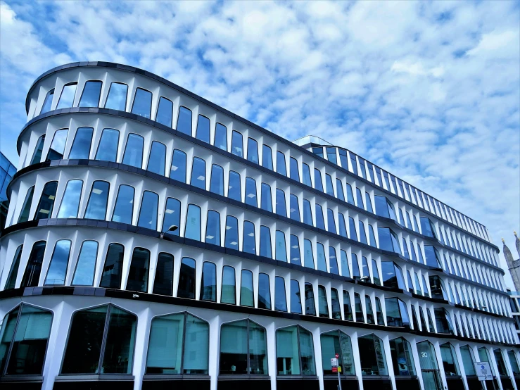 a very tall building with a lot of windows, unsplash, bauhaus, sky blue, square, ornate, ultrastation hq