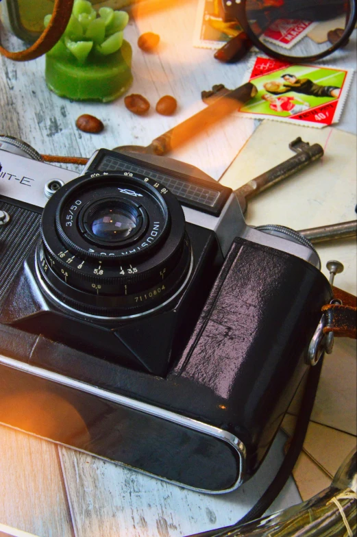 an old camera sitting on top of a table, a still life, inspired by Vivian Maier, close up food photography, super wide, travel photography, a high angle shot