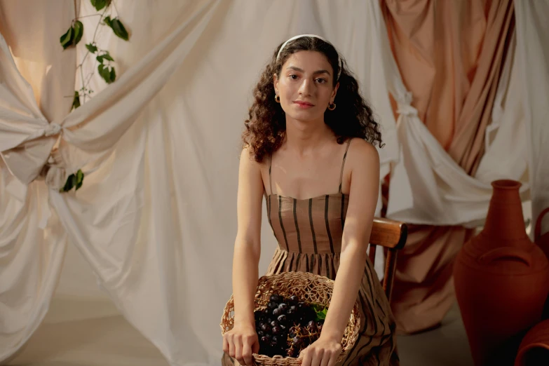 a woman sitting on a chair holding a basket of grapes, pexels contest winner, renaissance, portrait sophie mudd, organic dress, muted brown, in a style blend of botticelli