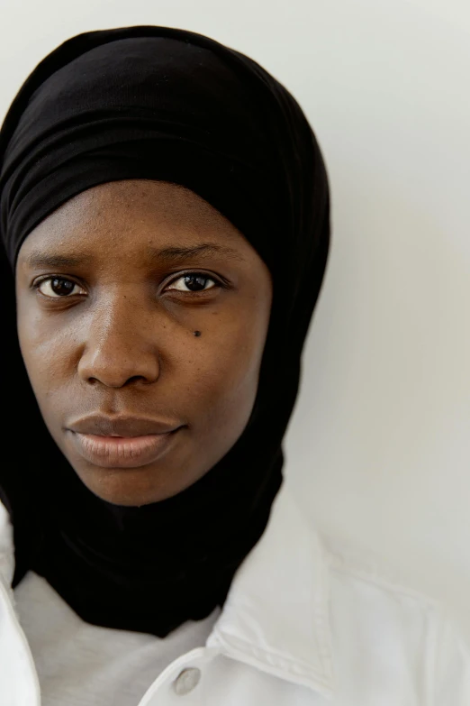 a close up of a person wearing a headscarf, maria borges, proud serious expression, black on white background, multiple stories