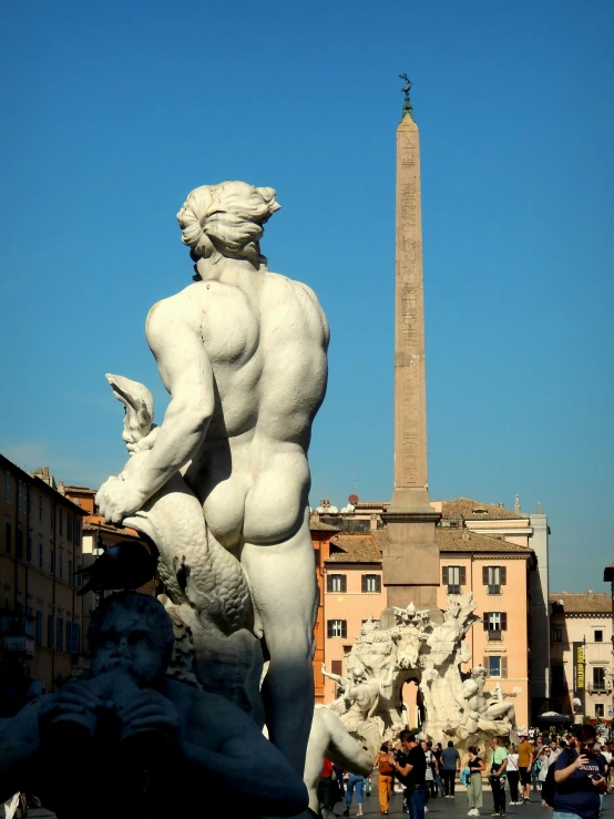 a statue of a man standing next to a fountain, by Cagnaccio di San Pietro, pexels contest winner, neoclassicism, obelisk, view from back, lewd, rome in background
