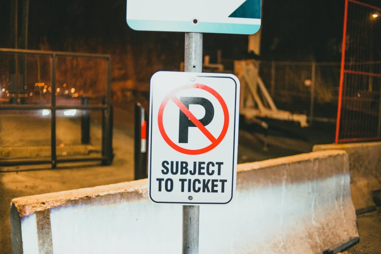 a no parking sign next to a no parking sign, pexels contest winner, ticket, thumbnail, sitting, test subject