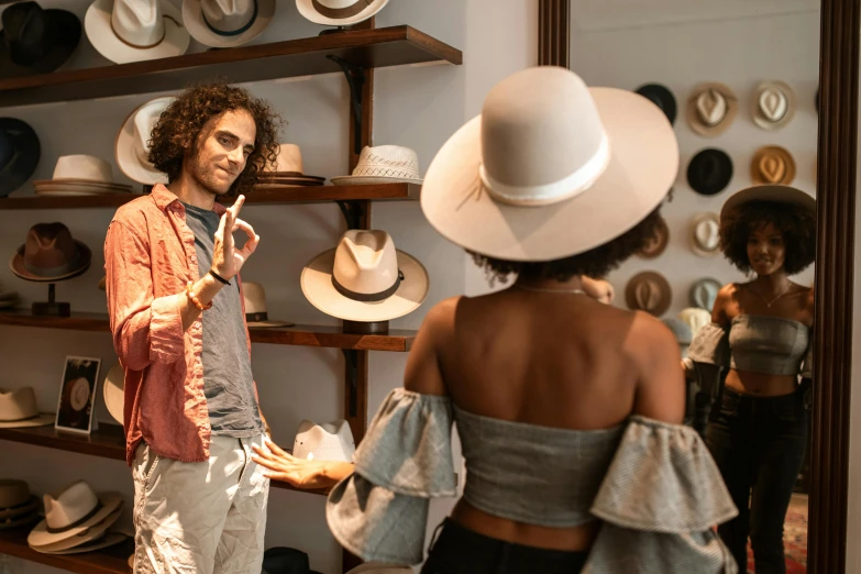 a man standing next to a woman in a hat shop, pexels contest winner, fan favorite, justina blakeney, avatar image, people shopping