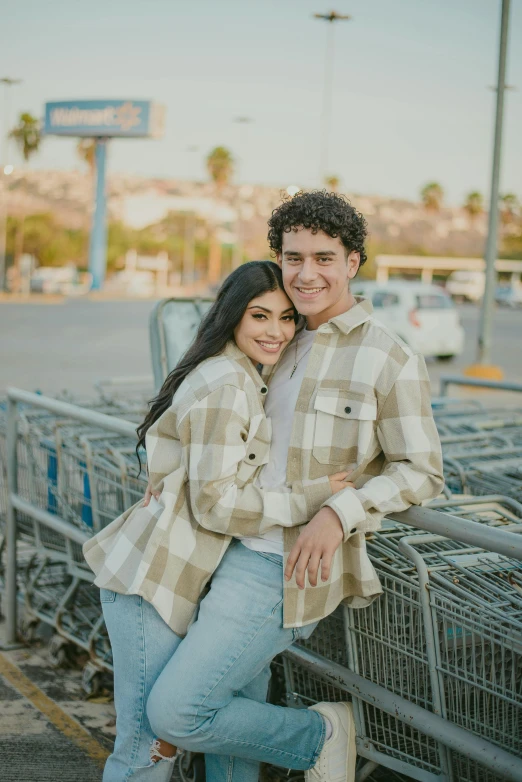 a man and a woman leaning against a fence, trending on pexels, stood in a supermarket, :: madison beer, high quality photo, square