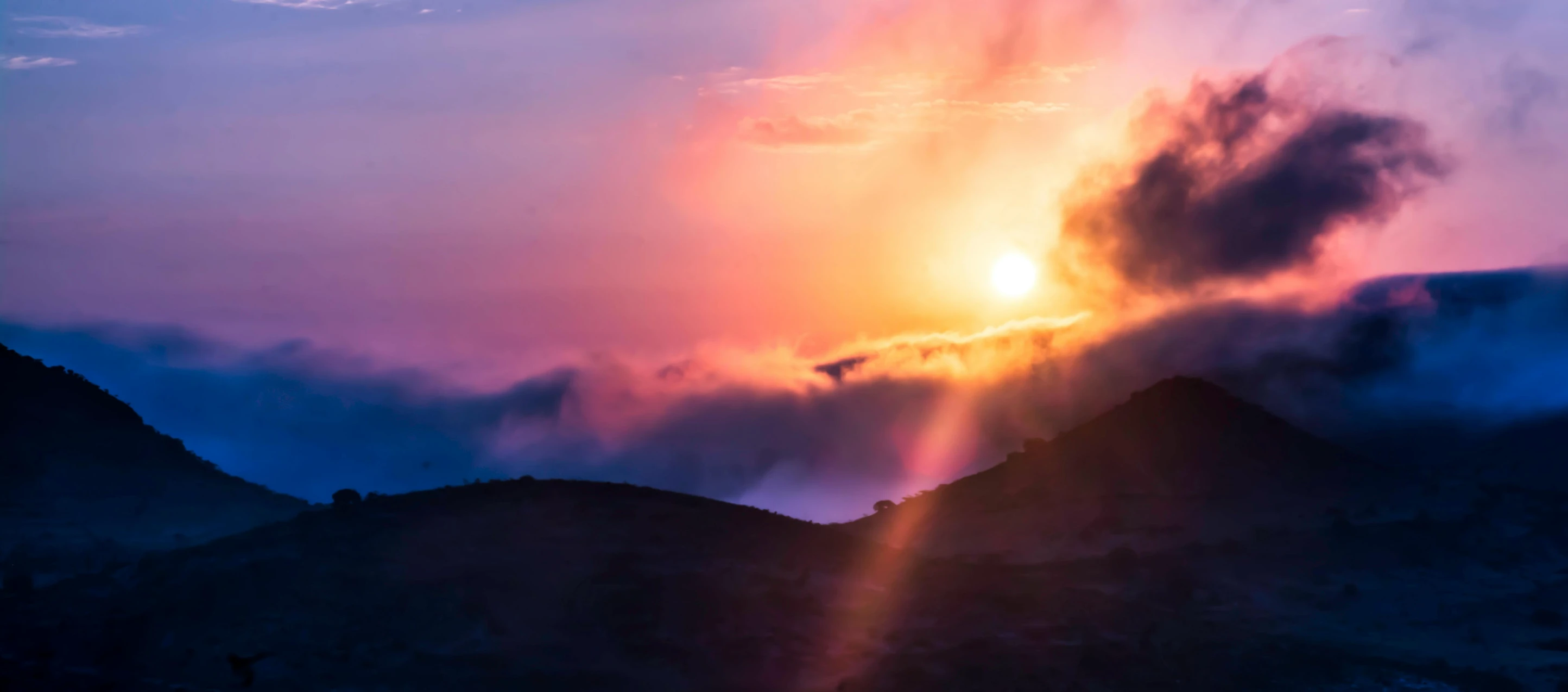 the sun is shining through the clouds over the mountains, pexels contest winner, romanticism, purple orange colors, ethereal rainbows, sun rising, instagram post