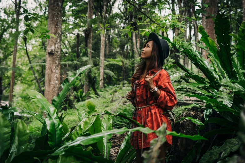 a woman in a red dress standing in a forest, by Julia Pishtar, sumatraism, wearing adventuring gear, avatar image, tropical mood, profile image