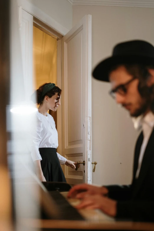 a man and a woman playing a piano, by Niko Henrichon, pexels contest winner, happening, doors to various bedrooms, jewish young man with glasses, wearing a tophat, ready for a meeting