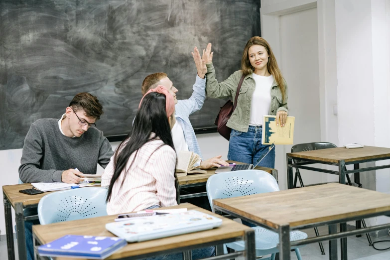 a group of people sitting at desks in a classroom, trending on pexels, academic art, greeting hand on head, lachlan bailey, thumbnail, background image