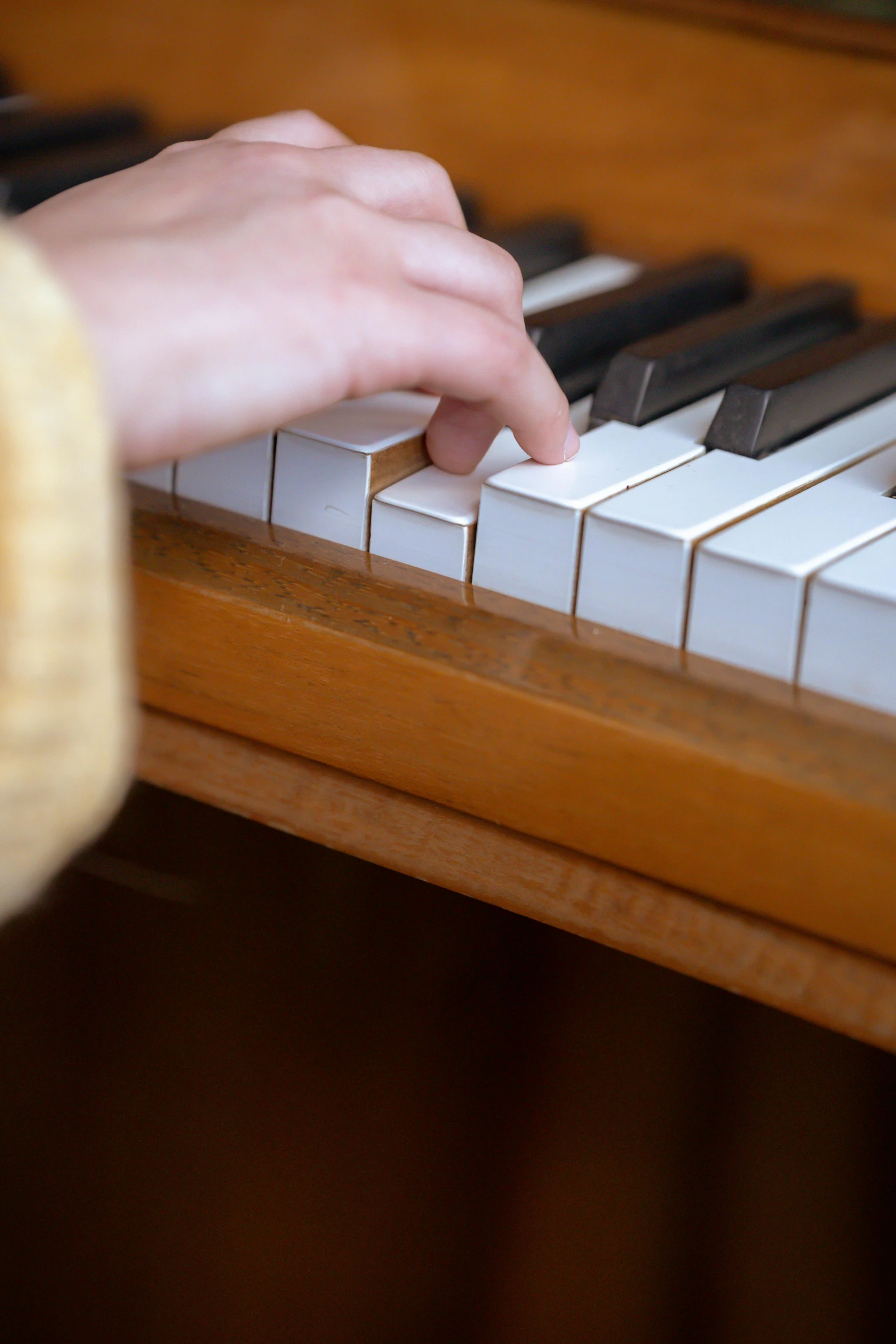 a close up of a person playing a piano