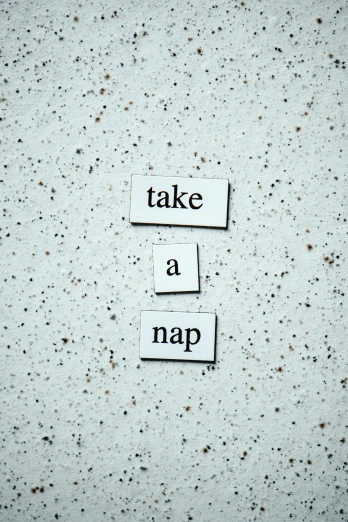 a piece of paper with the words take a nap on it, an album cover, unsplash, concrete poetry, sleepwear, slate, napa