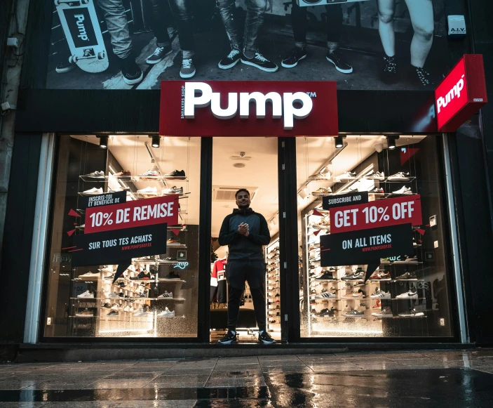 a man standing in front of a pump store, pexels contest winner, trending on r/streetwear, bumps, dr dre, jump