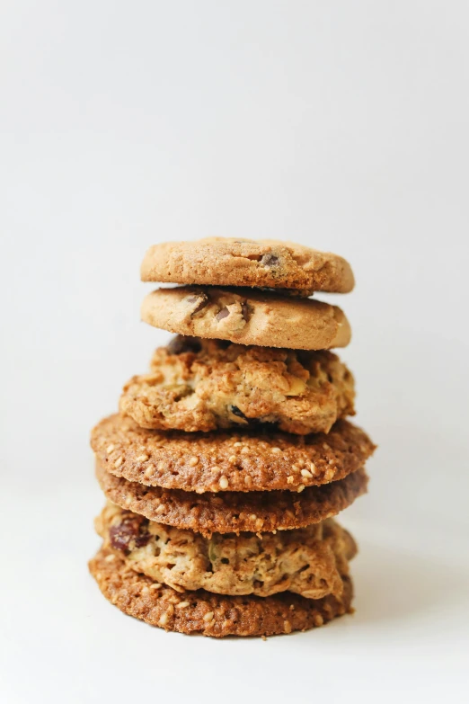 a stack of cookies sitting on top of each other, dwell, various sizes, tall shot, organics