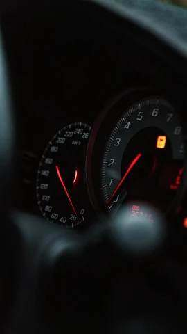 a close up of the dashboard of a car, unsplash, les automatistes, low quality photo, red rim light, racing, thumbnail