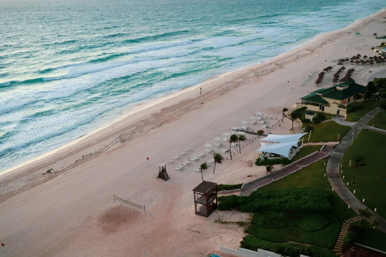 an aerial view of a beach next to the ocean, renaissance, exterior shot, white sand, profile pic, late morning