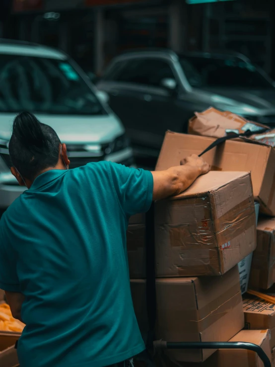 a man pushing a cart full of boxes, by Daniel Lieske, pexels contest winner, thumbnail, background image, profile picture, vhs colour photography