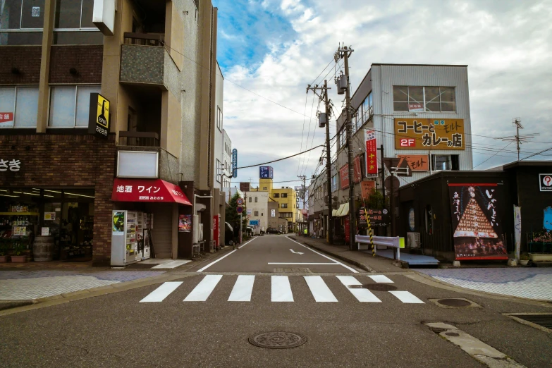 a street that has a crosswalk in the middle of it, a picture, unsplash, shin hanga, hyperrealism photo, けもの, 2 0 0 0's photo, small town surrounding