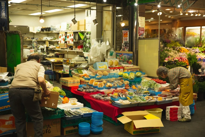 a couple of people that are in a market, by Yasushi Sugiyama, unsplash, panoramic shot, fan favorite, sunken, the store