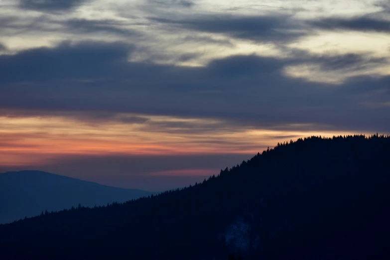 there is a plane that is flying in the sky, by Peter Churcher, pexels contest winner, romanticism, last light on mountain top, black forest, serene colors, today\'s featured photograph 4k