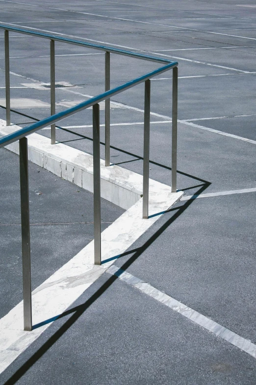 a tennis racket sitting on top of a tennis court, by Doug Ohlson, postminimalism, steps leading down, parked cars, railing, zig zag