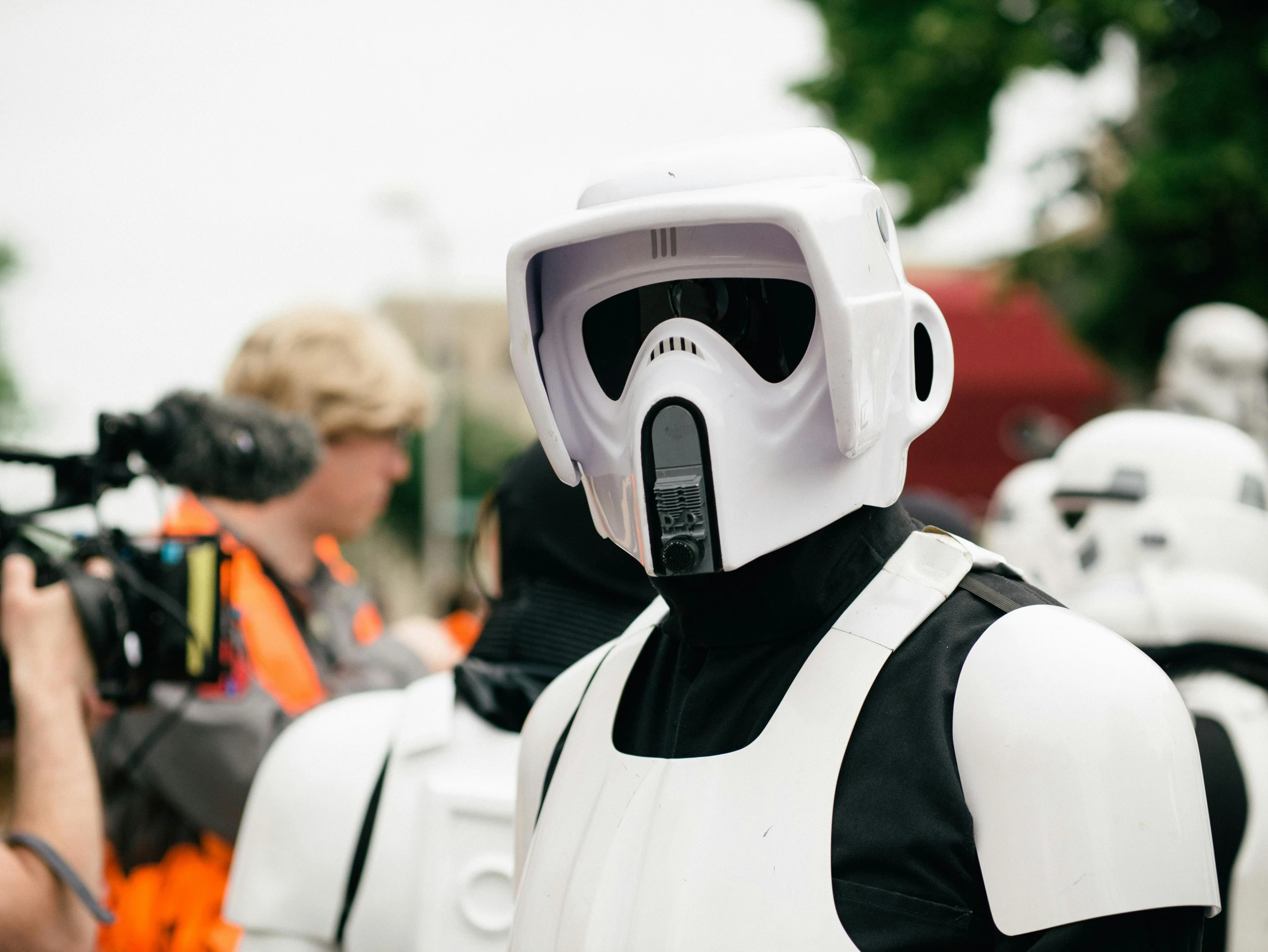 a group of people dressed in star wars costumes, unsplash, realism, white helmet, closeup photograph, smuggler, helm