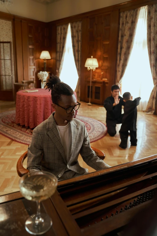 a man sitting at a piano in front of a mirror, ashteroth, in the white house, parental advisory, in spain