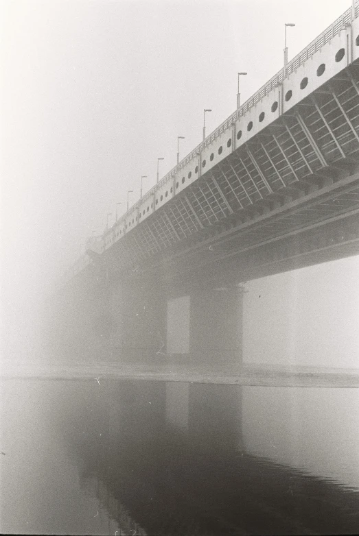 a black and white photo of a bridge on a foggy day, by Ryoji Ikeda, conceptual art, araki nobuyoshi, ffffound, 2022 photograph, album cover