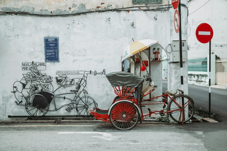 a red rickshaw parked on the side of a street, pexels contest winner, street art, malaysian, white wall coloured workshop, 🦩🪐🐞👩🏻🦳, historical photo