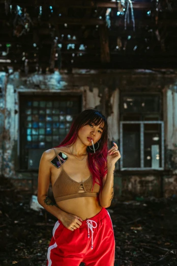 a woman with red hair standing in front of a building, pexels contest winner, graffiti, bralette, half asian, sexy :8, vintage color