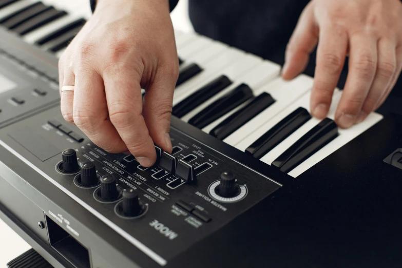 a close up of a person playing a keyboard