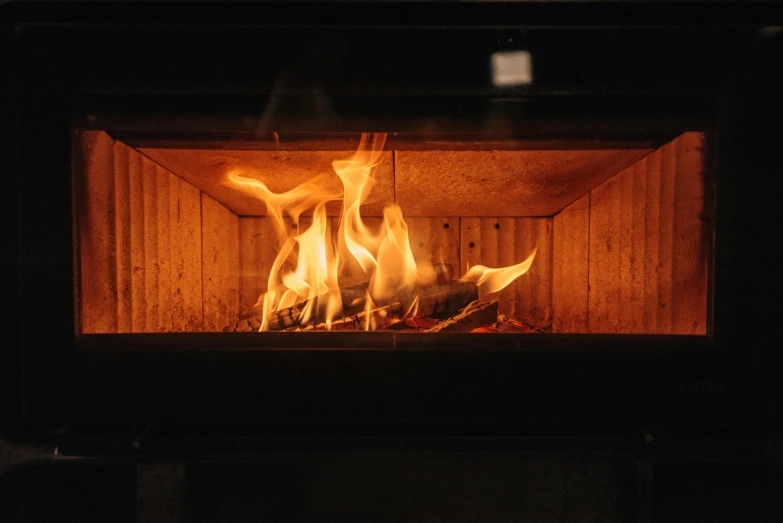 a close up of a fire in a stove, a digital rendering, pexels contest winner, cosy fireplace, fire beam, subtle details, fire punch
