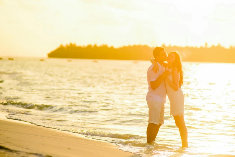 a couple kissing on the beach at sunset, pexels contest winner, golden hour in boracay, youtube thumbnail, white, sunny environment