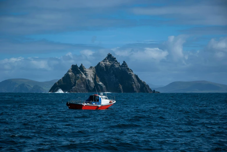 a small boat in the middle of a large body of water, by Carey Morris, pexels contest winner, irish mountains background, devils horns, rough waters, thumbnail