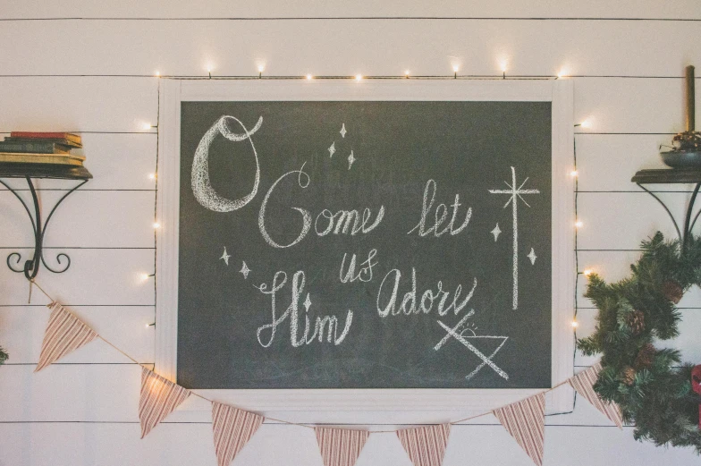 there is a chalk board with writing on it, inspired by Ernest William Christmas, unsplash, light and space, holy themed, cutest, biblically accurate, fully decorated