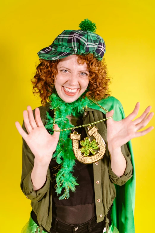 a woman dressed in a st patrick's day outfit, a photo, by Pamela Drew, pexels, square, yellow backdrop, comedic, ( redhead