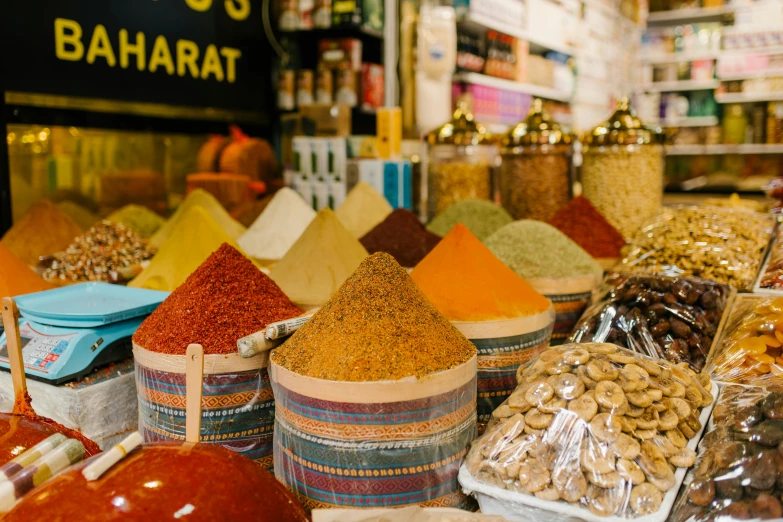 a store filled with lots of different types of spices, by Julia Pishtar, trending on unsplash, talaat harb square cairo, profile image, arab inspired, hartper's bazaar