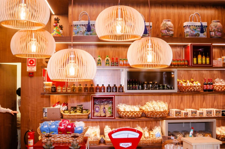 a store filled with lots of different types of food, by Julia Pishtar, warm lantern lighting, red and white lighting, arrendajo in avila pinewood, retro vibe