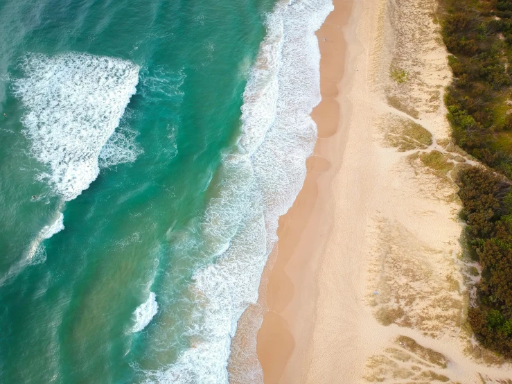 a large body of water next to a sandy beach, pexels contest winner, close-up from above, coastline, instagram post, australia