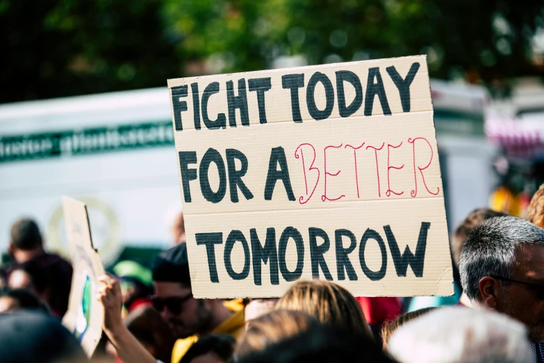 a sign that says fight today for a better tomorrow, by Julia Pishtar, protest, feature, thumbnail, sustainable
