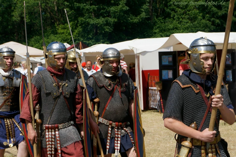 a group of men in armor standing next to each other, inspired by Roman Bezpalkiv, reddit, festival, merchant tents, avatar image