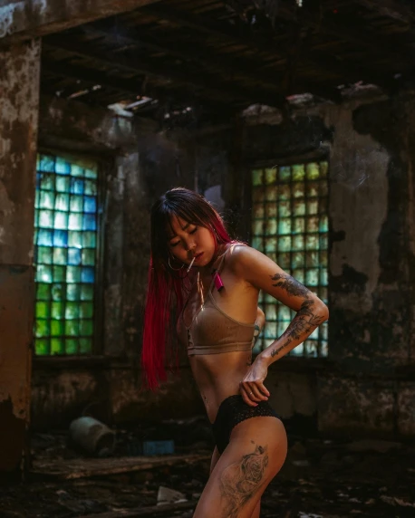 a woman with tattoos standing in an abandoned building, inspired by Elsa Bleda, unsplash contest winner, 8 0 s asian neon movie still, sexy :8, tinyest midriff ever, she is dancing
