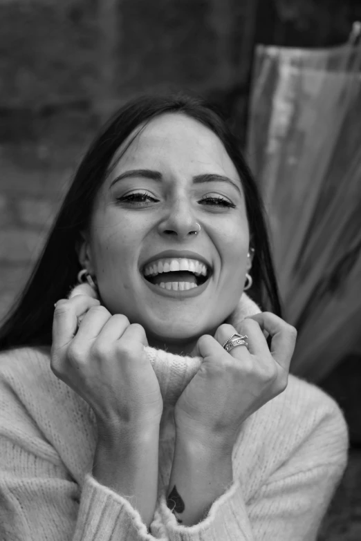 a black and white photo of a woman laughing, inspired by Anita Malfatti, female camila mendes, beautiful iranian woman, happily smiling at the camera, uploaded