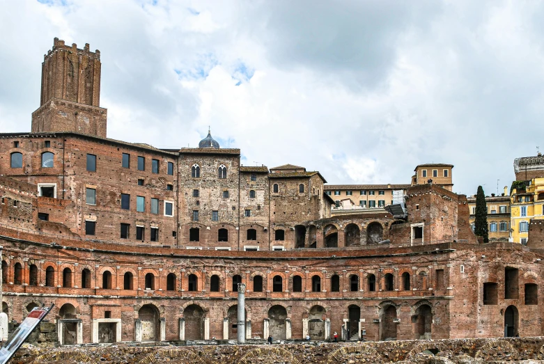a group of people standing in front of a building, inspired by Romano Vio, pexels contest winner, renaissance, panoramic view, brick building, opus tesellatum, rustic