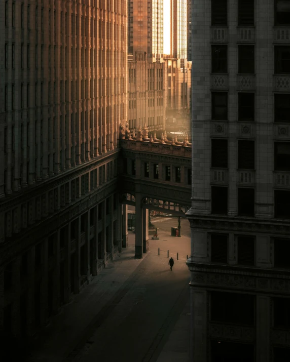 a very tall building sitting in the middle of a city, a matte painting, unsplash contest winner, photorealism, location [ chicago ( alley ) ], early morning light, ignant, 8k artistic 1920s photography