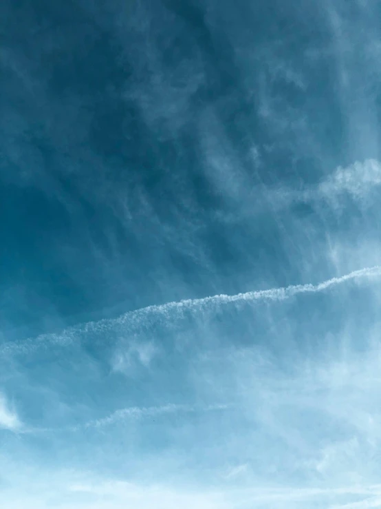 there is a plane that is flying in the sky, by Niko Henrichon, pexels contest winner, minimalism, breath condensation, low angle 8k hd nature photo, hyperdetailed, sky gradient