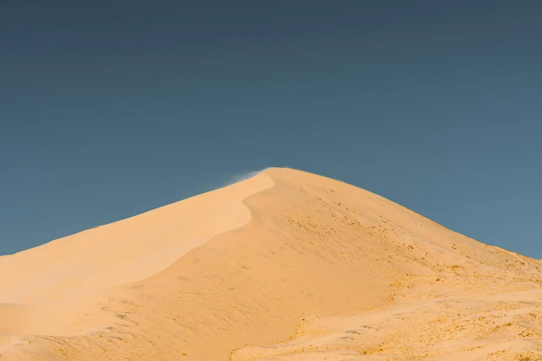 a man riding a snowboard on top of a sandy hill, an album cover, unsplash contest winner, les nabis, sand color, sinuous, australian desert, in shades of peach