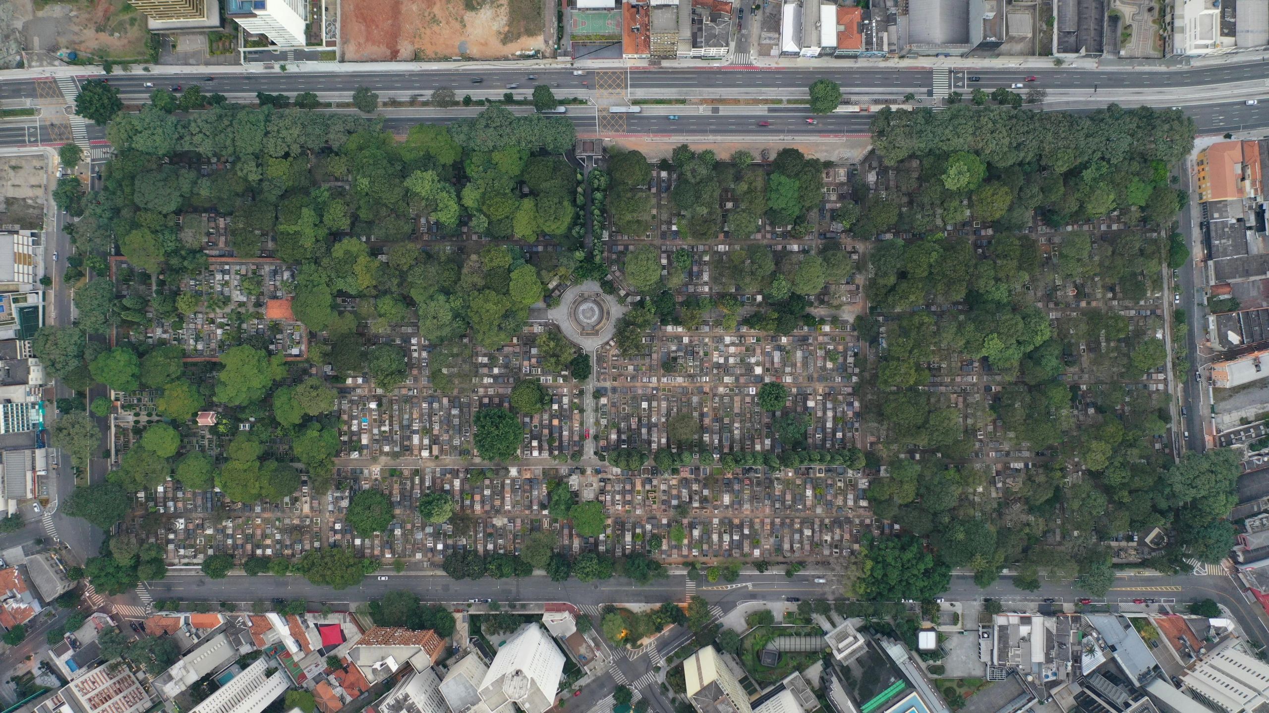 an aerial view of a city with lots of trees, an album cover, by Luis Miranda, reddit, conceptual art, big graveyard gravestones, singapore ( 2 0 1 8 ), ffffound, in sao paulo